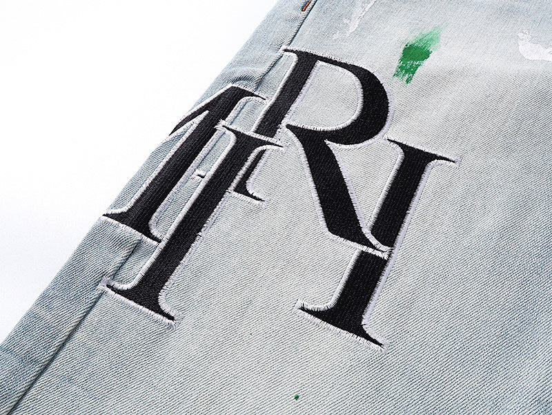Amiri Staggered Logo Painted Jeans
